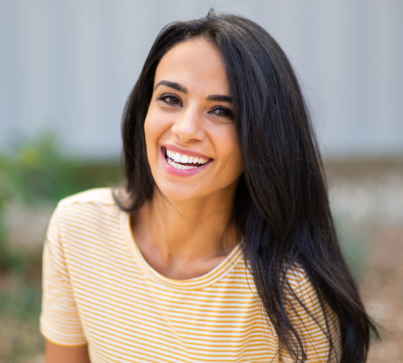 smiling patient happy with her invisalign at The Smile Sanctuary in Aubrey TX